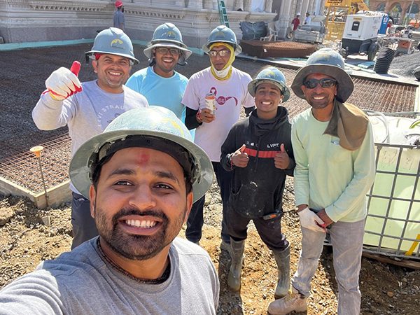 Neel P. taking a selfie with volunteers while contributing his time to the construction of BAPS Akshardham in Robbinsville, New Jersey.