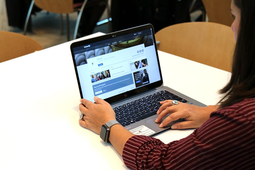 close-up of employee updating their social media profile