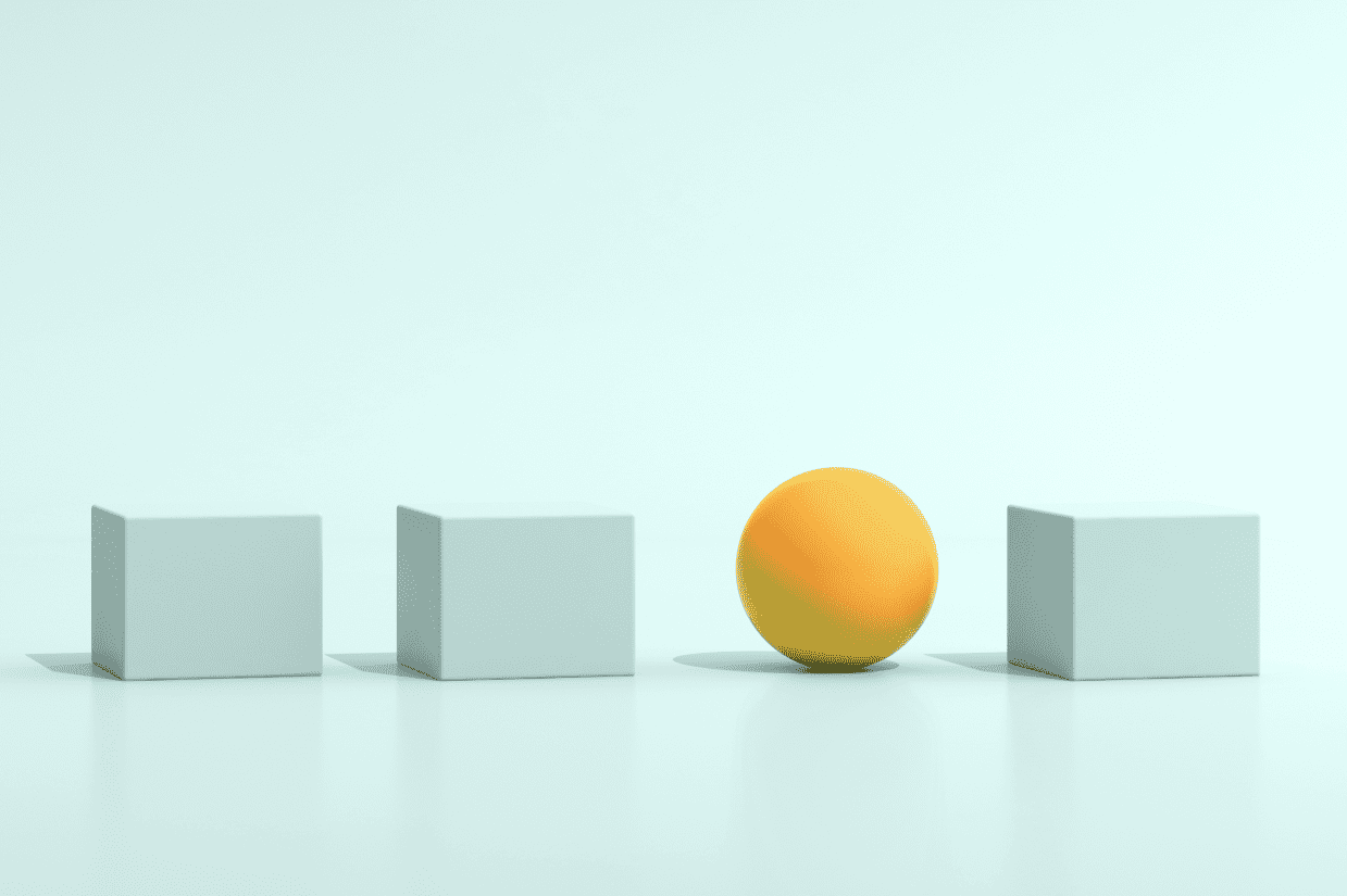 Three pale turquoise cubes and a bright yellow sphere sit against a pale turquoise backdrop, representing innovation.